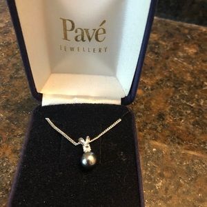 Grey pearl with cubic zirconia stone on sliver chain.